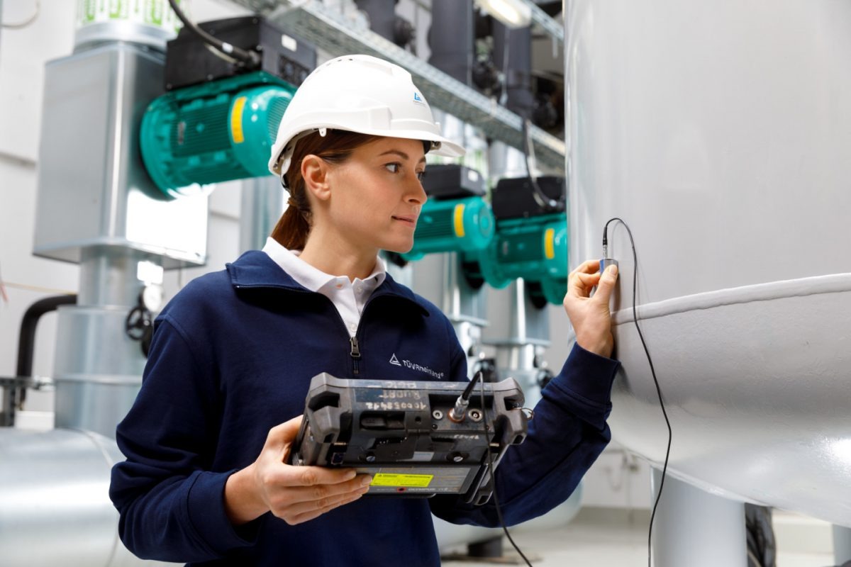 Engineer reviewing risk-based inspection data on equipment